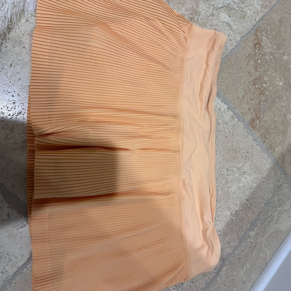 Orange lululemon skirt size 14,